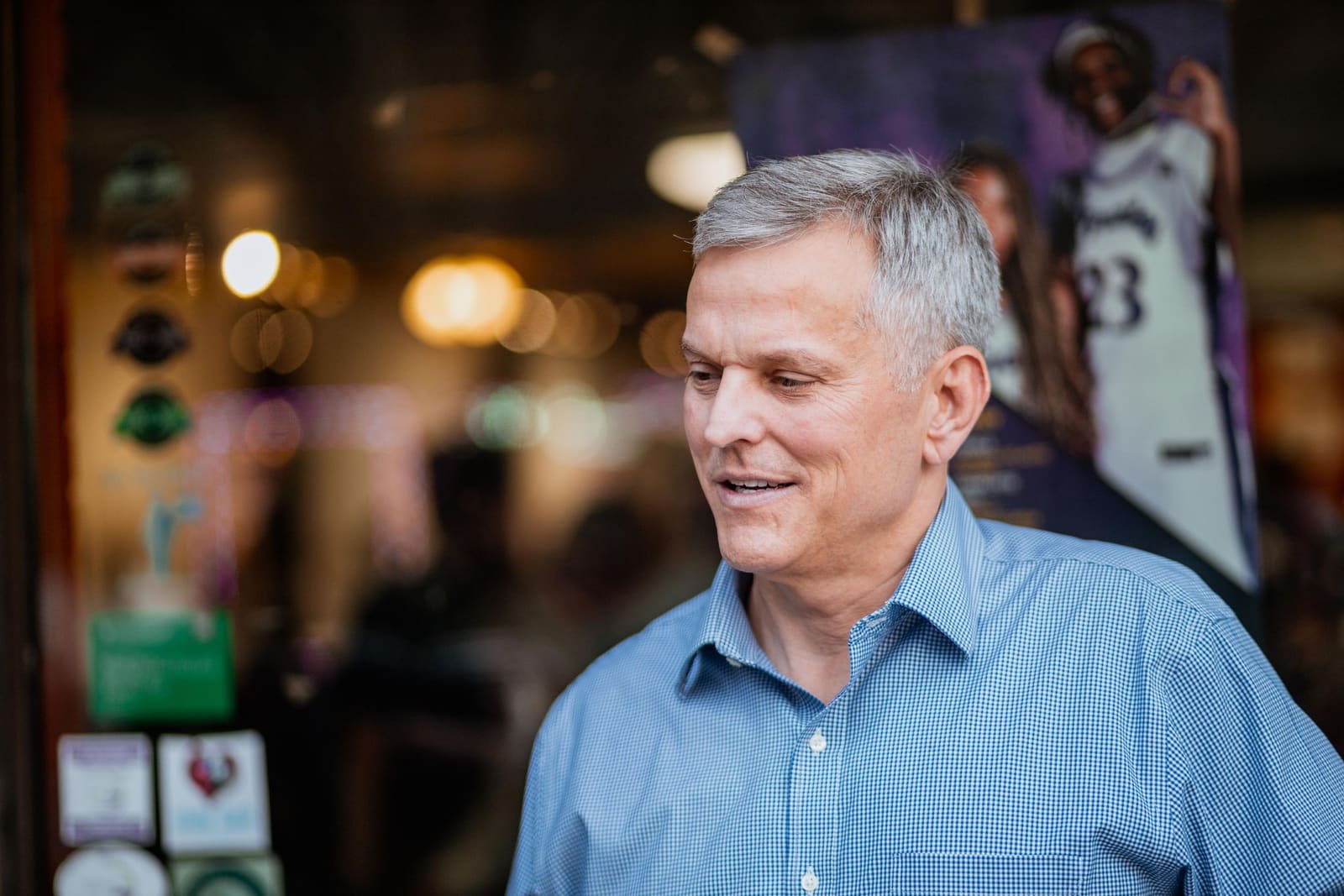 Josh Stein smiles outside a shop in downtown Greenville, NC