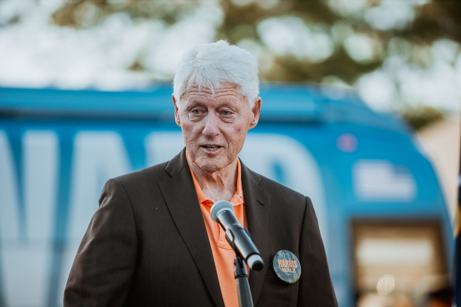 Bill Clinton at the microphone at an outdoor rally in Greenville, NC