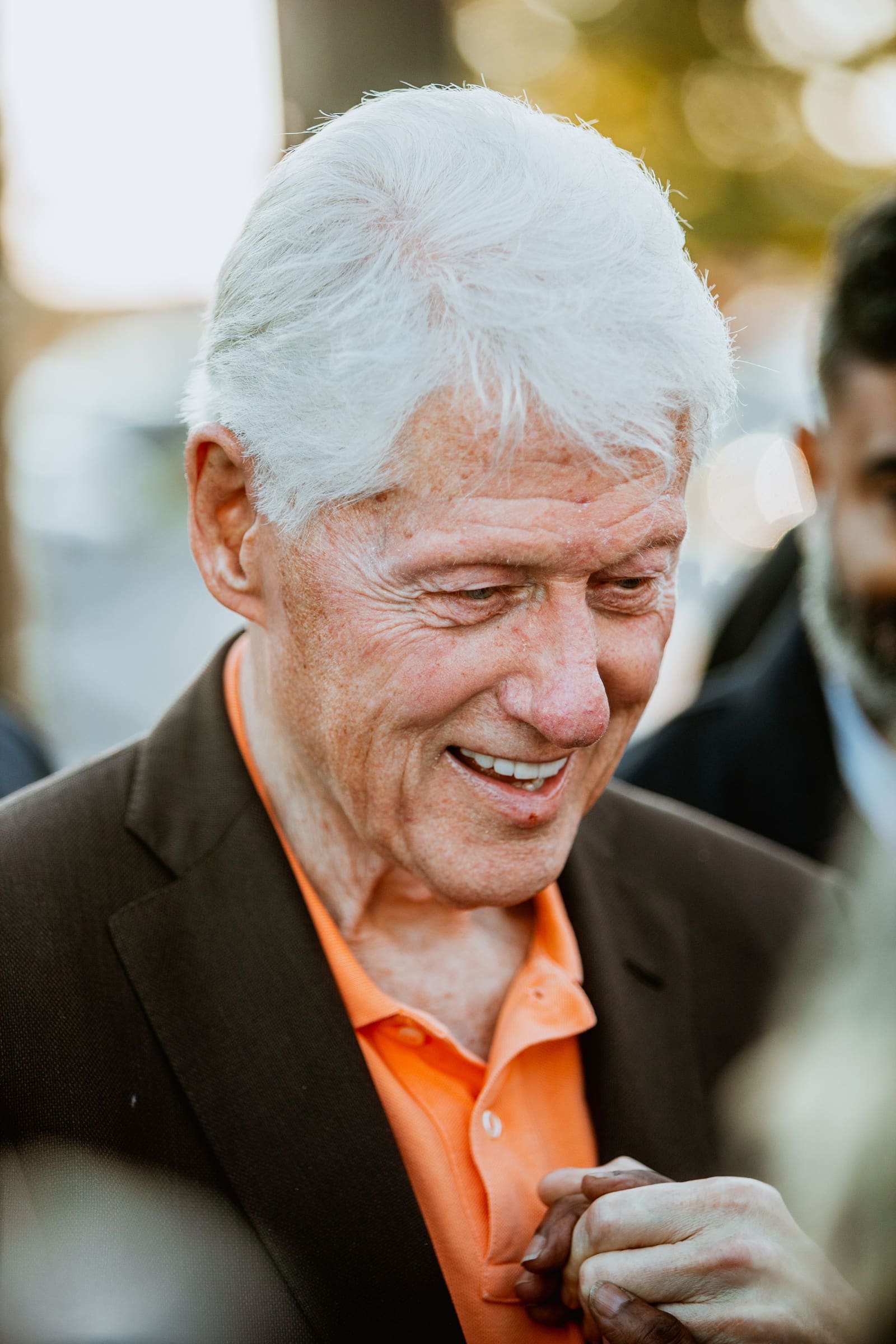 Bill Clinton laughing in a close portrait, Greenville, NC, October 2024