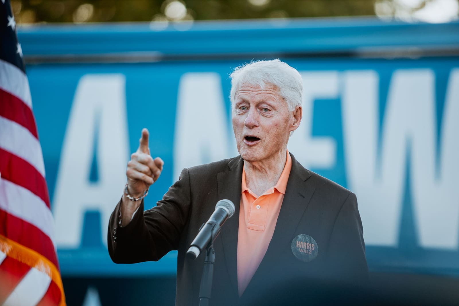 Bill Clinton points while speaking at an outdoor rally in Greenville, NC