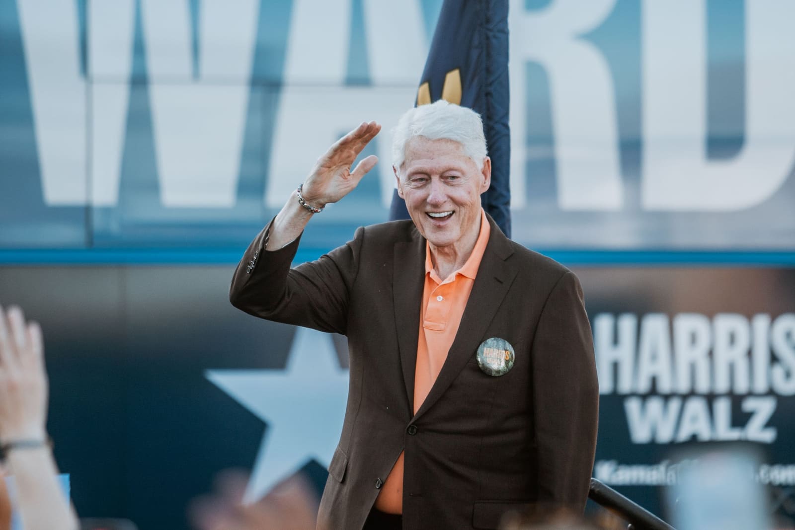 Bill Clinton waves to the crowd at a Greenville, NC rally