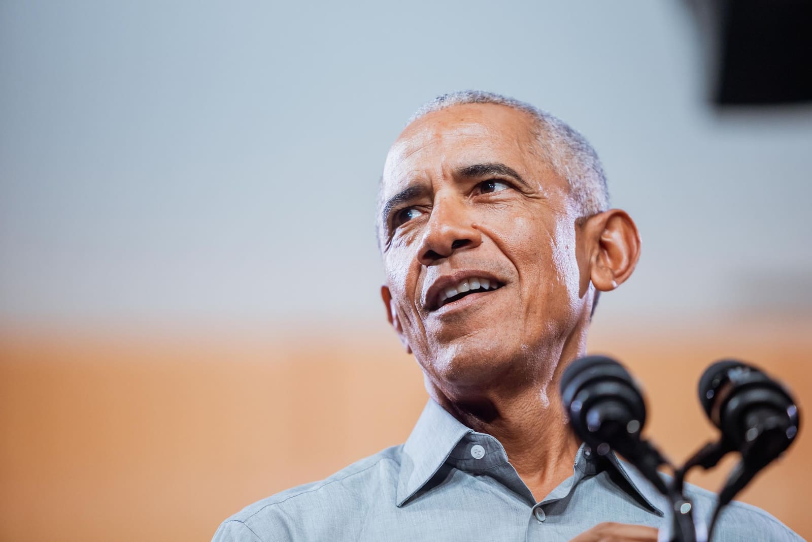 Barack Obama smiles at the microphones in Charlotte, NC