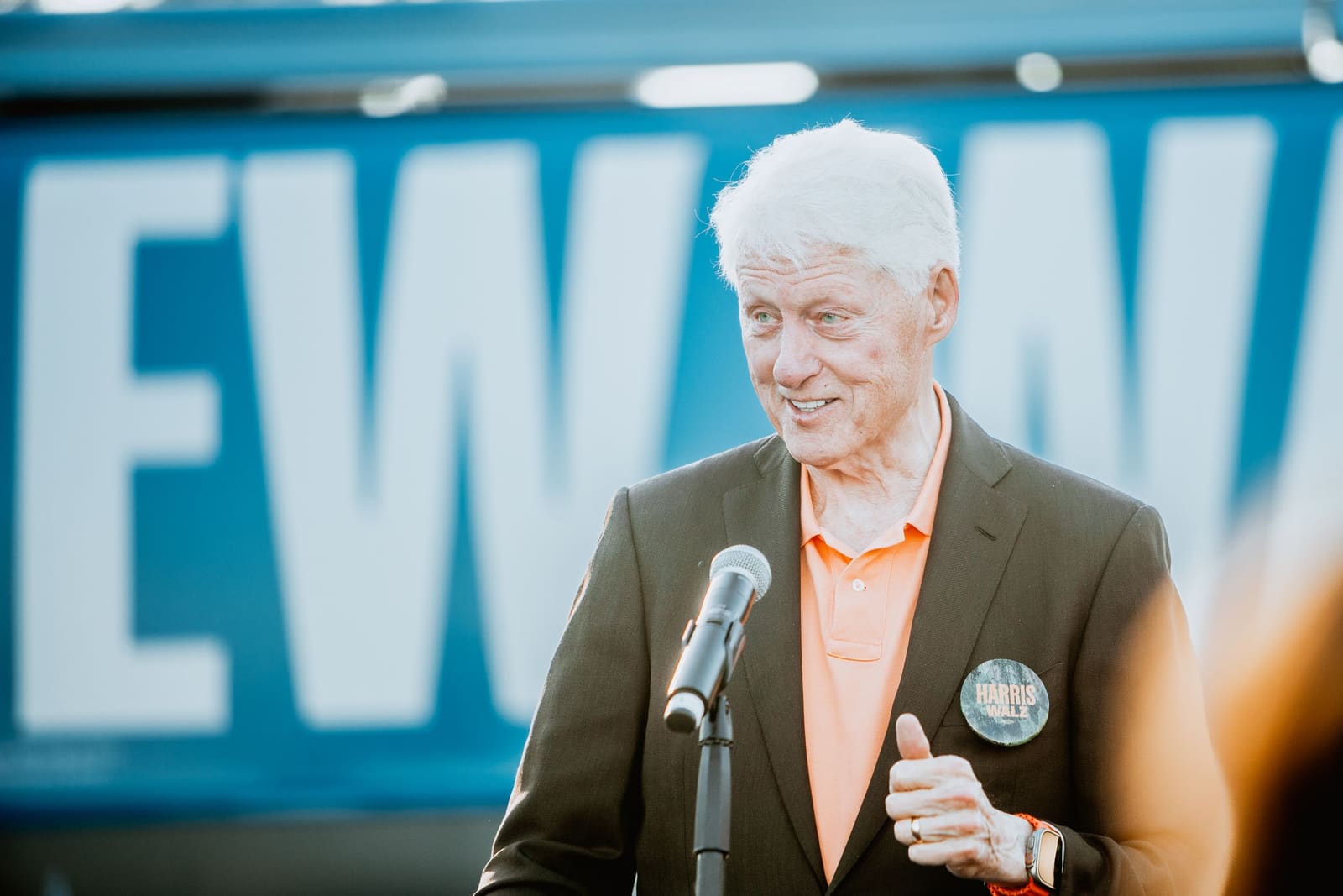 Bill Clinton smiles at the podium at a Greenville, NC rally