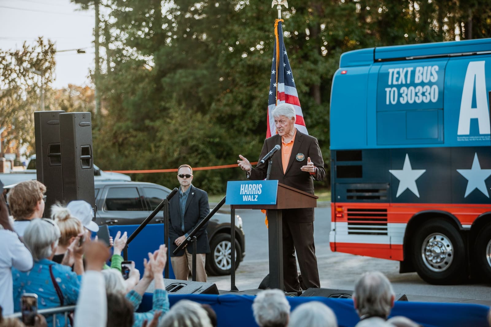 Bill Clinton speaks in front of the campaign bus in Greenville, NC