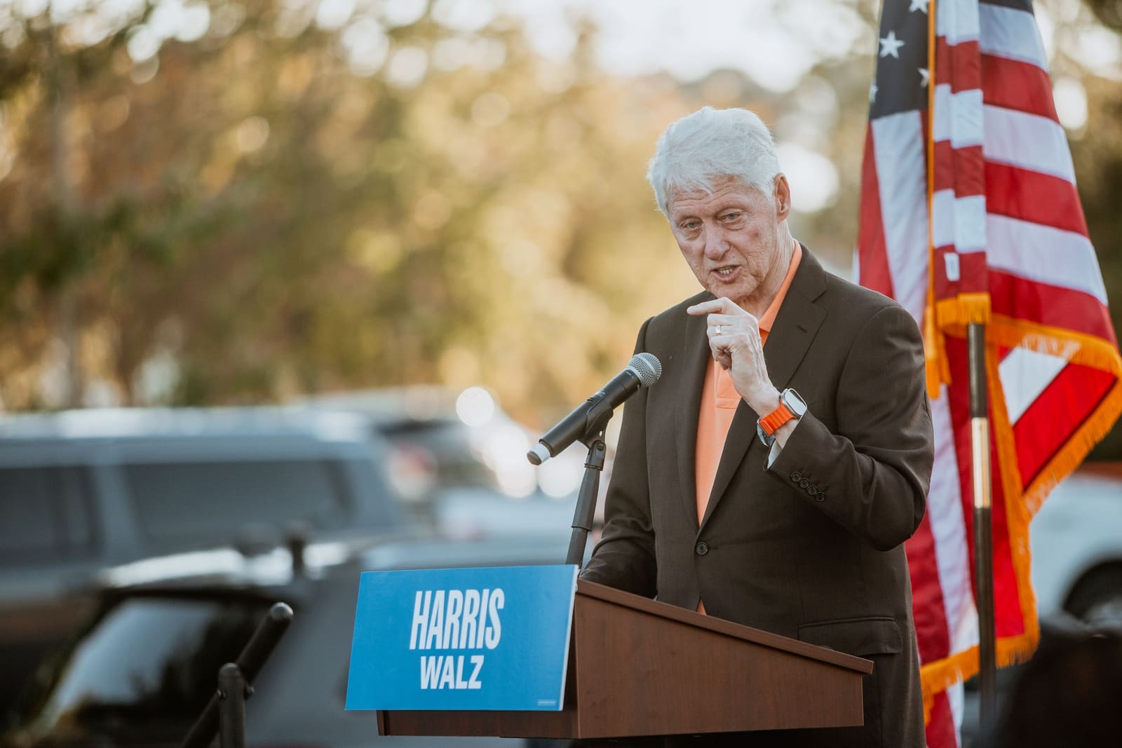 Bill Clinton at the podium at an outdoor rally in Greenville, NC