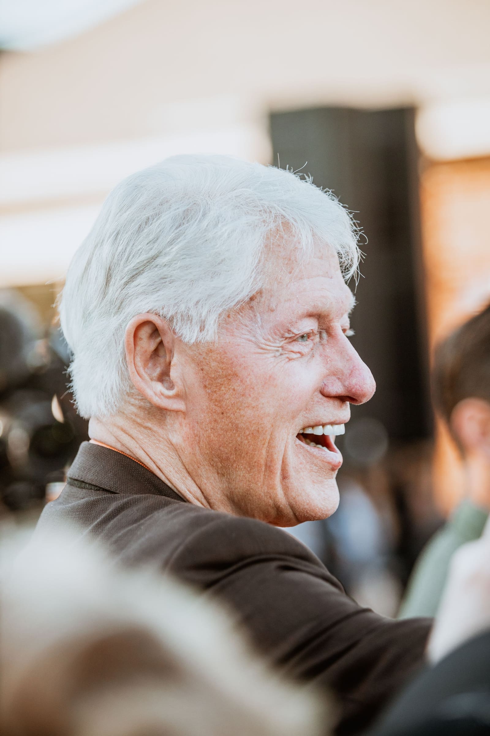 Bill Clinton laughing in profile, Greenville, NC