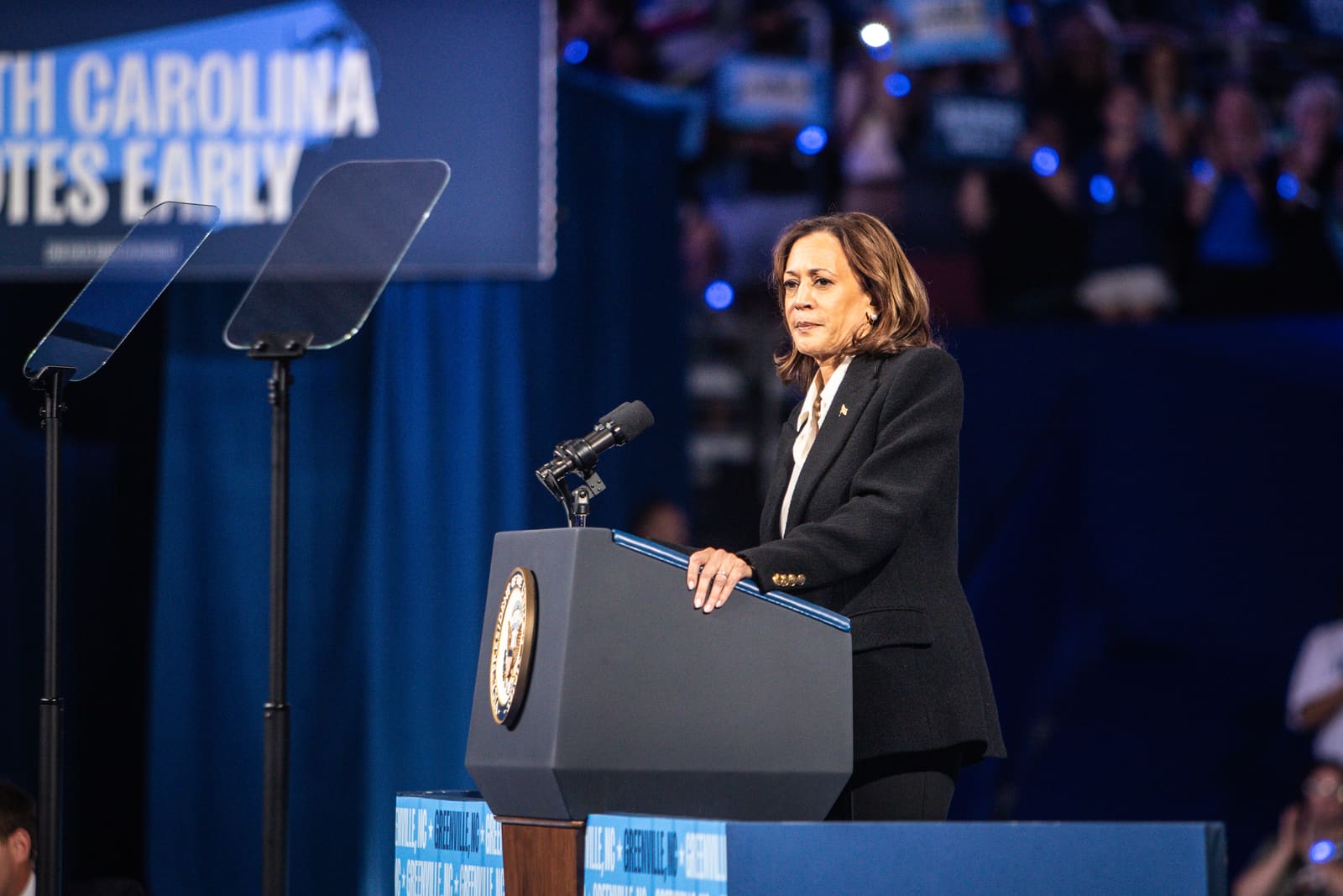 Kamala Harris speaking at the podium under a North Carolina votes early banner