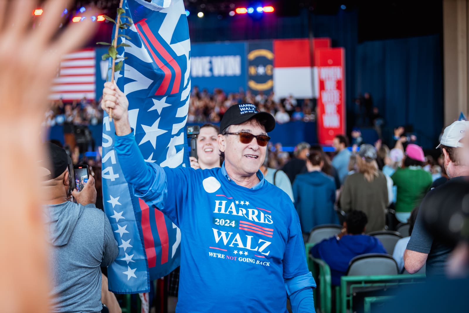 Supporter waving a Harris flag