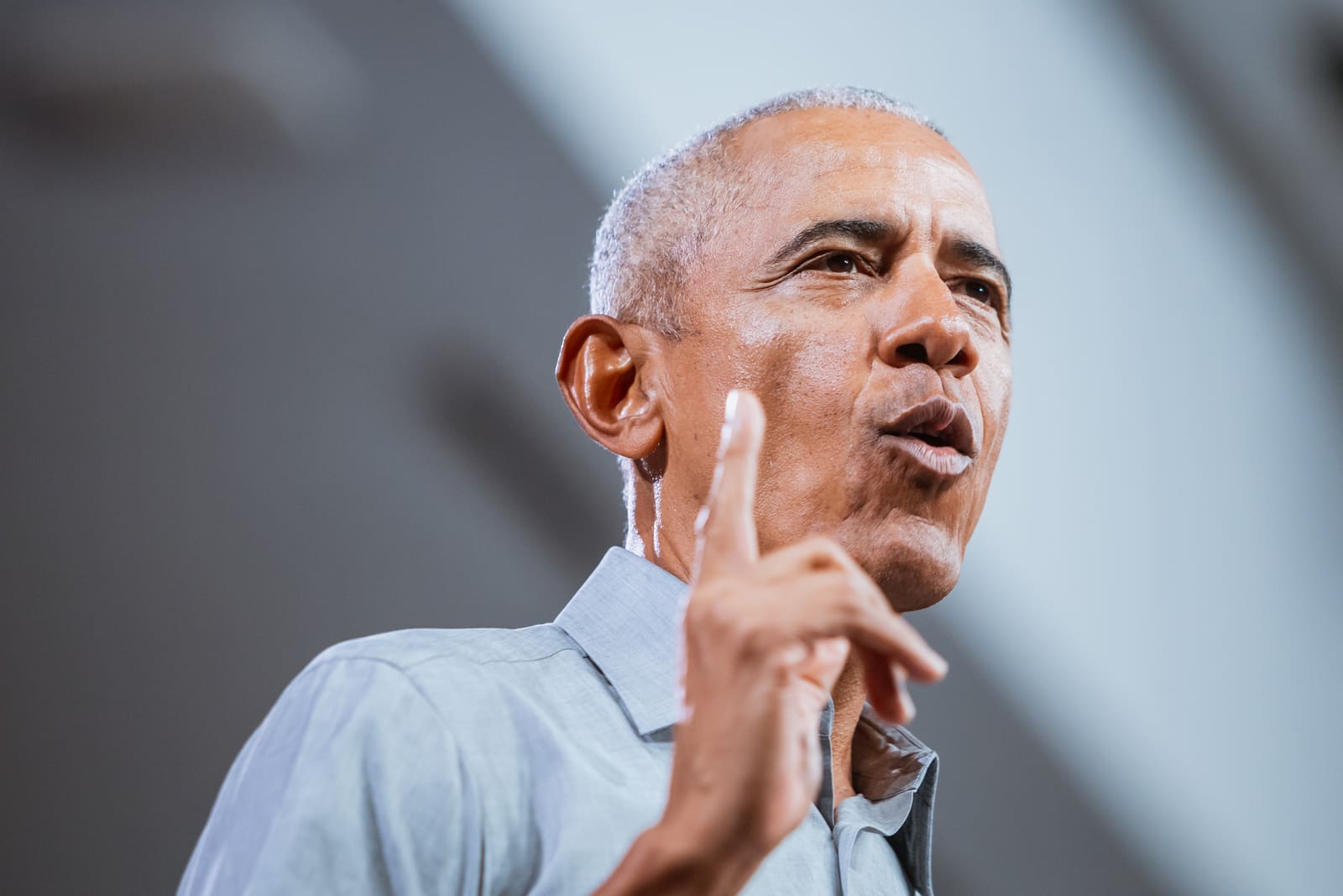 Barack Obama with a raised finger, close portrait
