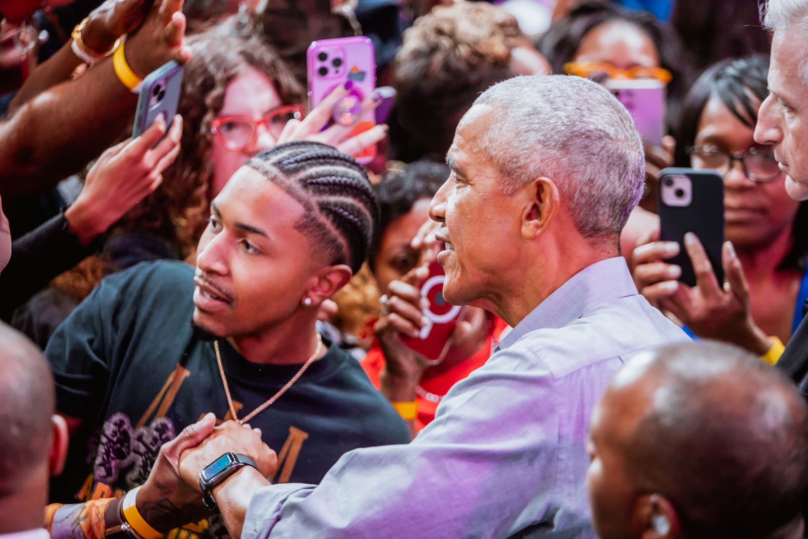 Barack Obama greeting a young supporter at the barricade