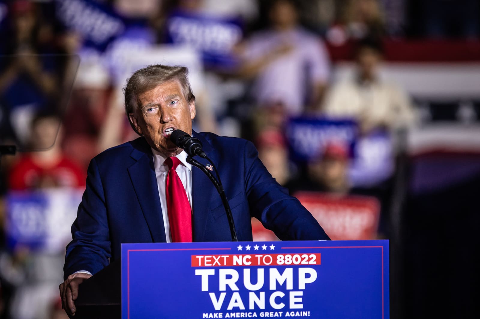 Donald Trump leaning on the lectern